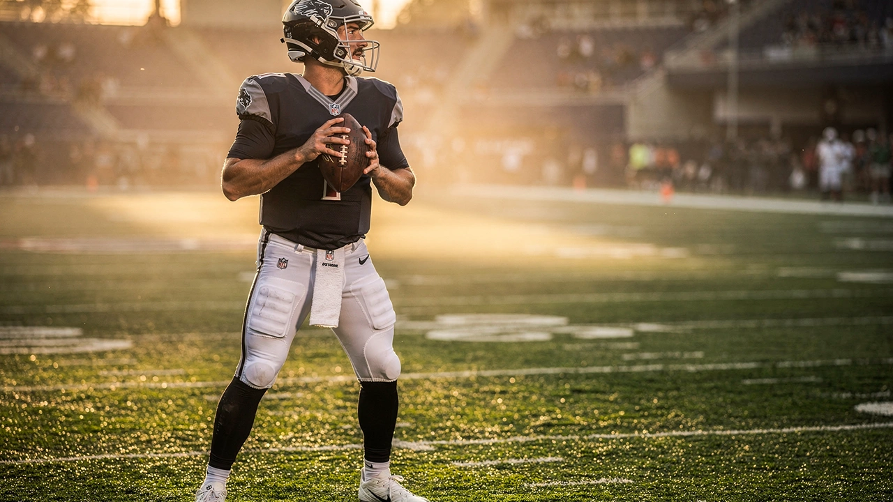 American-Football-Spieler wirft einen Pass auf dem beleuchteten Spielfeld bei einem NFL-Spiel